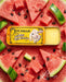 a tin of Lucamar lip balm surrounded by slices of watermelon and black seeds.