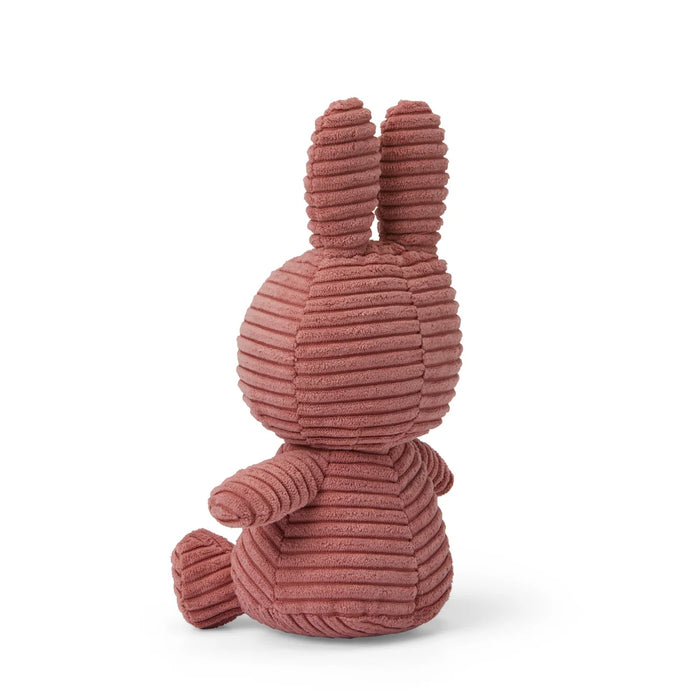 A plush toy of a bunny rabbit in a pink color.