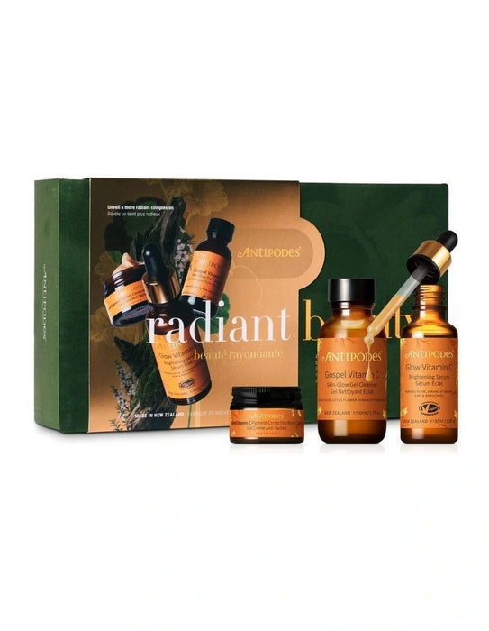 a set of beauty products from the brand Antipodes, including a radiant skin care set, a glow vitamin C serum, and a vitamin E serum.