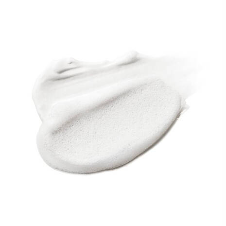 A white, foamy substance is shown against a white background.