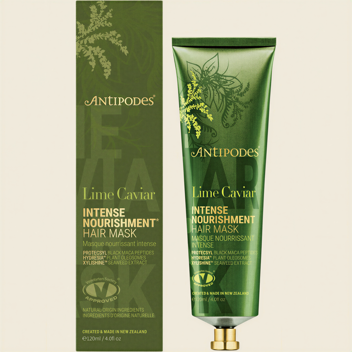 two tubes of anti-aging hair mask from the brand Antiopes. The left tube is a larger one, while the right one is a smaller one. Both tubes are green and have a floral design on them.