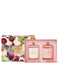 two soy candle sets in a pink box with a floral design.