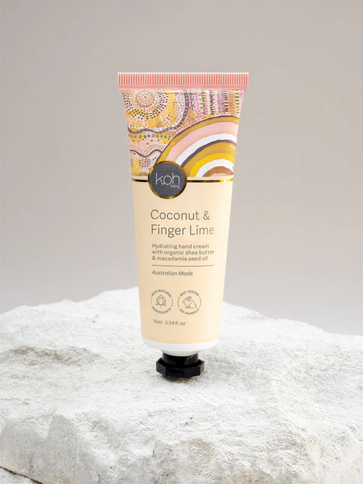 A tube of coconut and finger lime hand cream is shown against a white background.