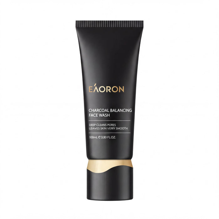 a tube of black and gold face wash product with the brand name "eAORON" printed on it.