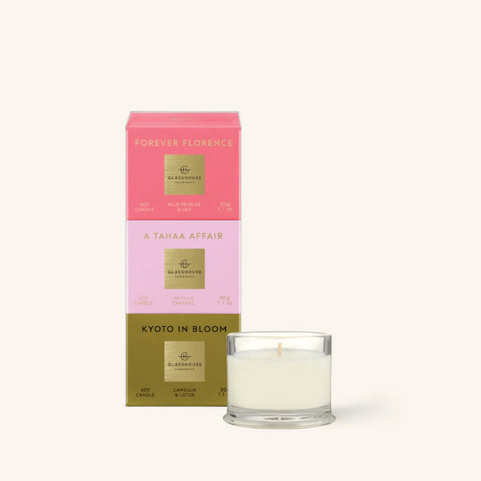 a set of three boxes and a small glass candle, all related to the brand "Forever Florence".