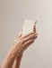 A pair of hands holding a bar of soap.