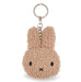 A keychain in the shape of a bunny with a fuzzy texture and a black eye and nose.