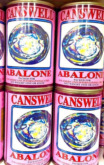 several cans of Campbell's Abalone soup stacked on a shelf.