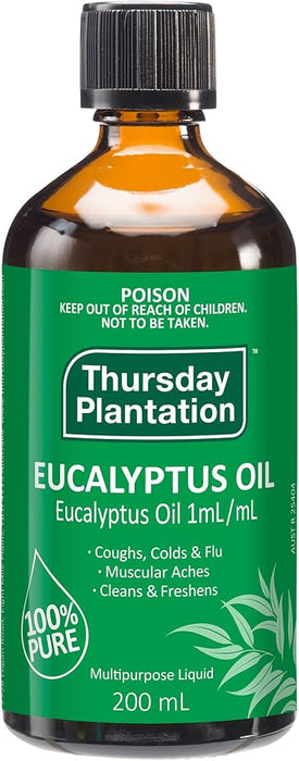 A bottle of eucalyptus oil with a green label and a black cap.