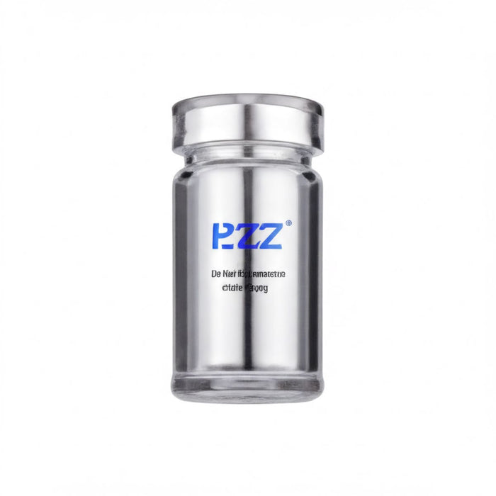 A clear glass bottle with a silver cap, containing a blue-colored substance.