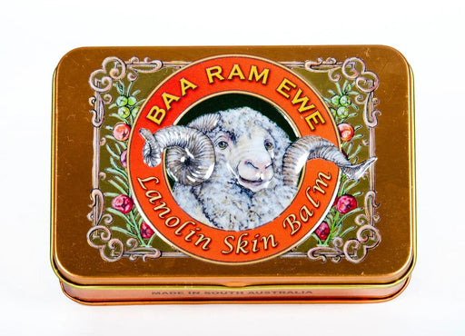 a tin can with a picture of a ram's head and the text "BAA RAM EWE Lanolin Skin Balm" around it.