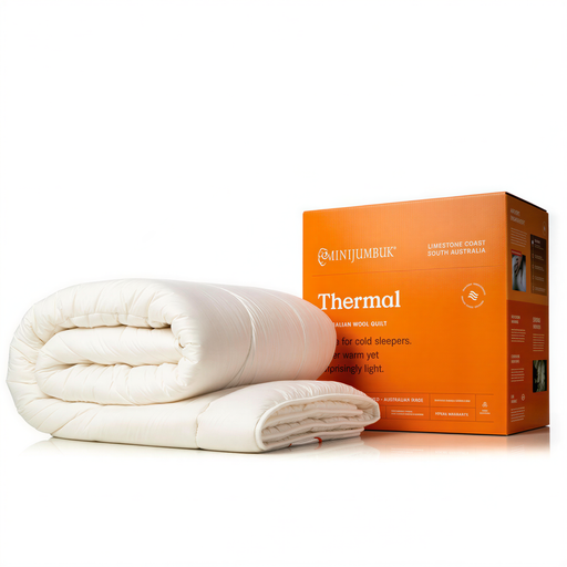 a white comforter and a box of the same comforter, both placed on a white background.