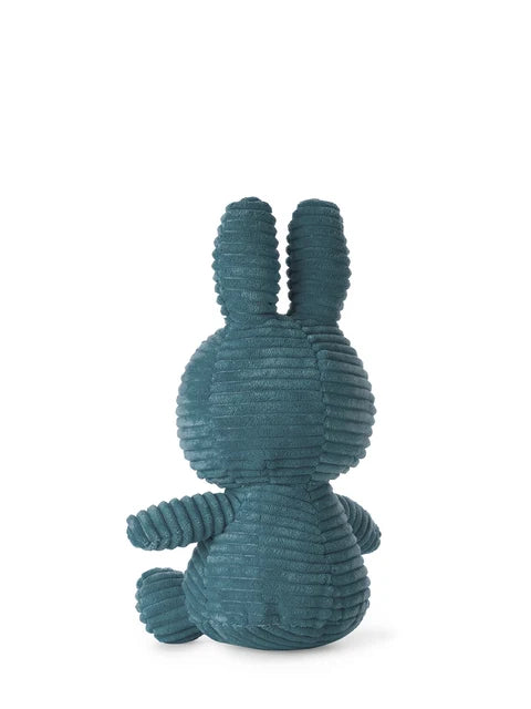 A green plush toy rabbit sitting upright on its hind legs against a white background.