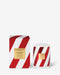 a red and white striped box and a white and red striped candle container, both of which are labeled as "Naughty & Nice Handmade" and "Candy Cane".