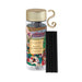 A clear glass bottle with a gold cap, containing a colorful illustration of a winter wonderland scene, along with a set of black sticks.