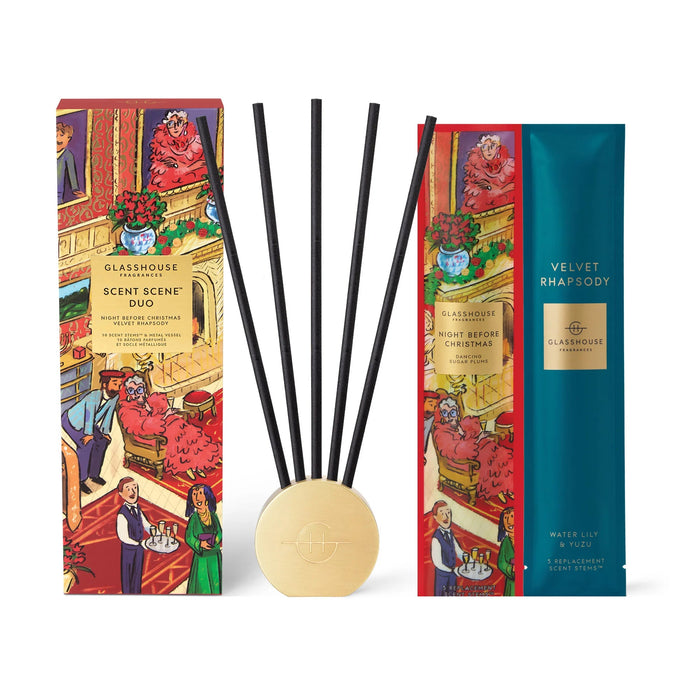 two boxes of glasshouse scent duo and velvet rhapsody, along with a set of black reeds and a small round gold object.