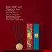 a set of five black incense sticks arranged in a circular pattern on a red surface, with a blue box labeled "Velvet Rhapsody" next to them.