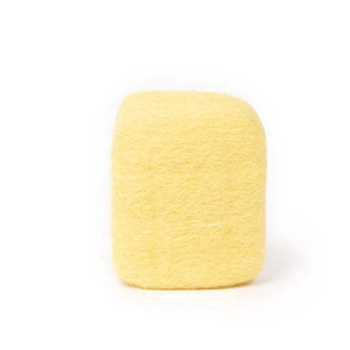 A single, yellow, fuzzy object is shown against a white background.