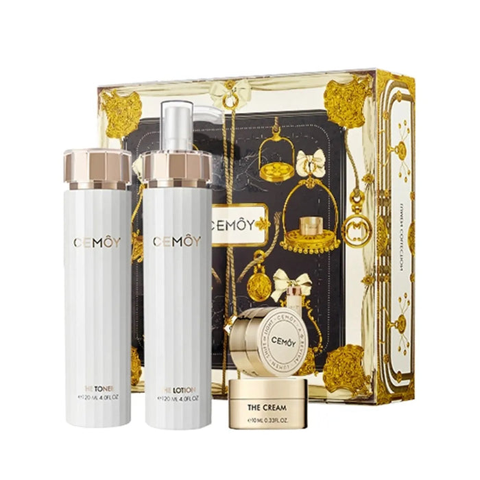 a set of beauty products, including two toners, a cream, and a cream, presented in a luxurious gold and black box with a decorative design.