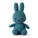 A blue plush toy rabbit with large ears and a small black nose.