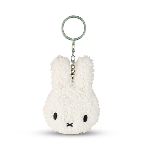 A white plush rabbit keychain with a black eye and nose design.