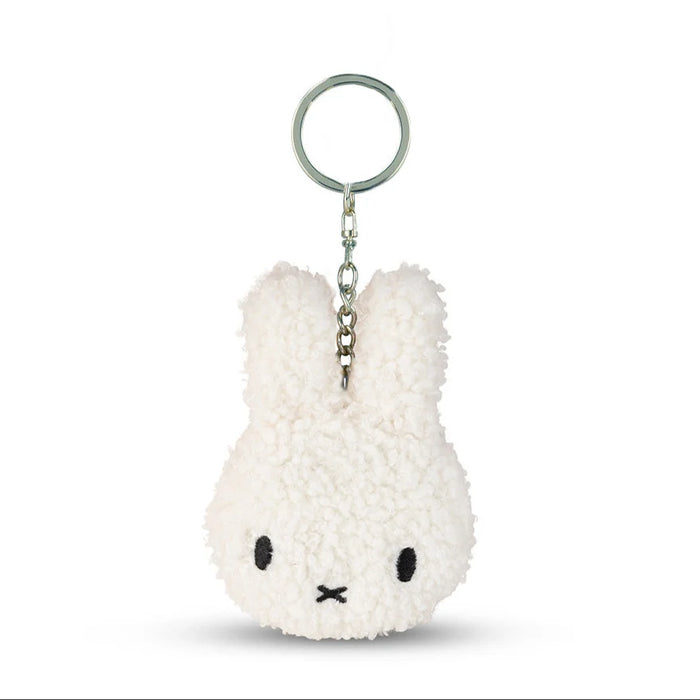 A white plush rabbit keychain with a black eye and nose design.