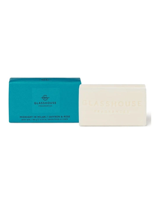 A blue box and a white rectangular bar of soap are shown against a white background.