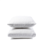 Two white pillows stacked on top of each other against a white background.