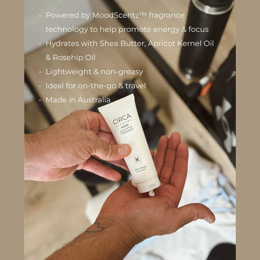 A person's hand holding a tube of CIRCA hand cream, with a focus on the product's features and benefits.