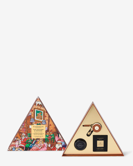 a triangular box with a colorful, illustrated design on it, and a smaller triangular box with a lid and a small black object inside.