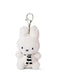 A small white plush bunny toy with a black and white striped scarf attached to it.