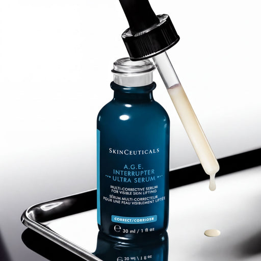A bottle of SkinCeuticals Age-Interrupter Ultra Serum is shown with a dropper, indicating that the product is ready for use.
