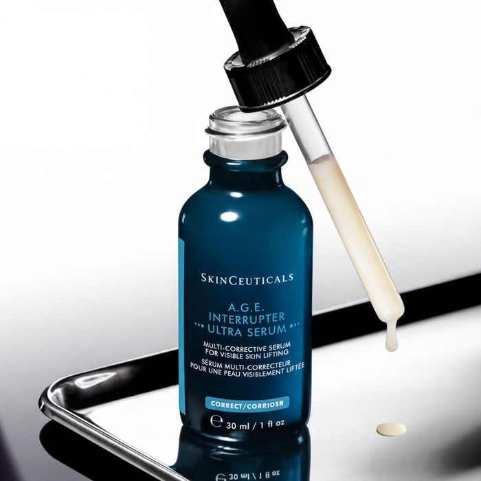 A bottle of SkinCeuticals Age-Interrupter Ultra Serum is shown with a dropper, indicating that the product is ready for use.