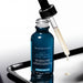 A bottle of SkinCeuticals Age-Interrupter Ultra Serum is shown with a dropper, indicating that the product is ready for use.