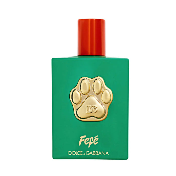 a green perfume bottle with a red cap, a gold paw print design, and the text "Fépe" and "Dolce & Gabbana" printed on it.