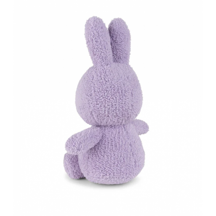 A purple plush bunny toy is sitting on a white background.