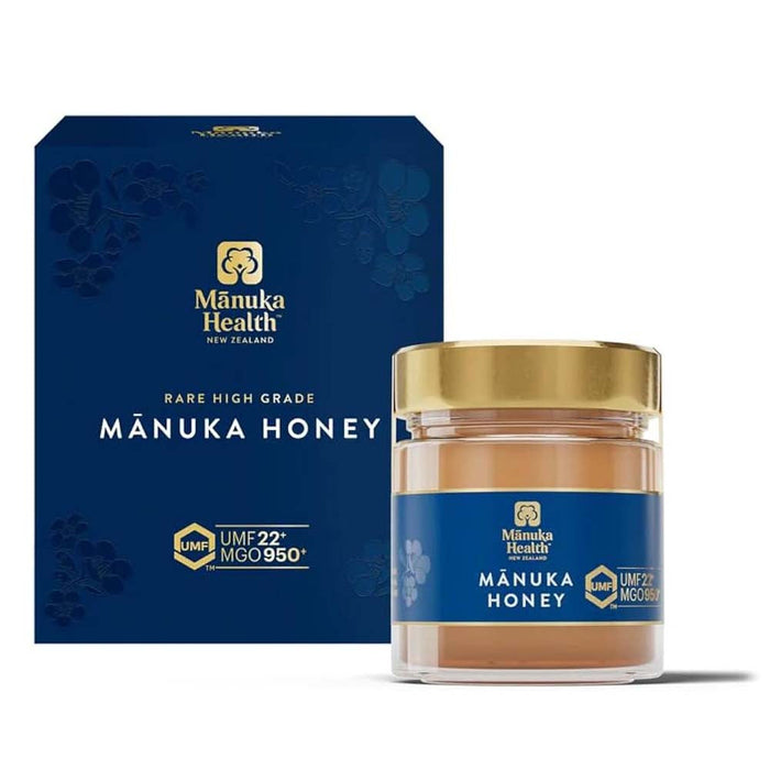 a jar of Manuka Honey next to its packaging box.