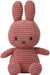 A pink, furry stuffed rabbit toy with large ears and a black mouth.