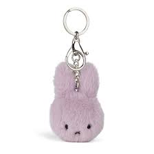 A keychain in the shape of a small, plush bunny with a silver clasp.