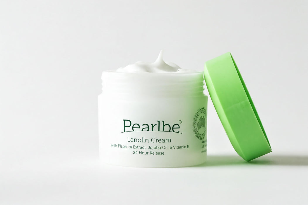 A jar of Lanolin Cream with a green lid, placed on a white background.