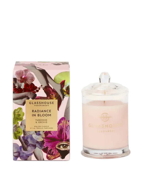a pink candle box and a glass candle holder, both with the brand name "GLASSHOUSE" printed on them.
