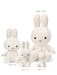A collection of four white stuffed rabbits of different sizes, ranging from 50 cm to 23 cm in height.