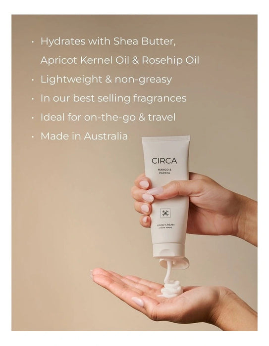 A person's hands holding a tube of CIRCA hand cream, with the cream being applied to their hand.