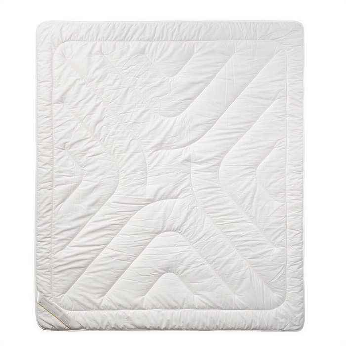 A white, square-shaped quilt or blanket with a geometric pattern.