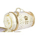 A white and gold rolled-up bedding item with a crown logo on it, placed on a white surface.