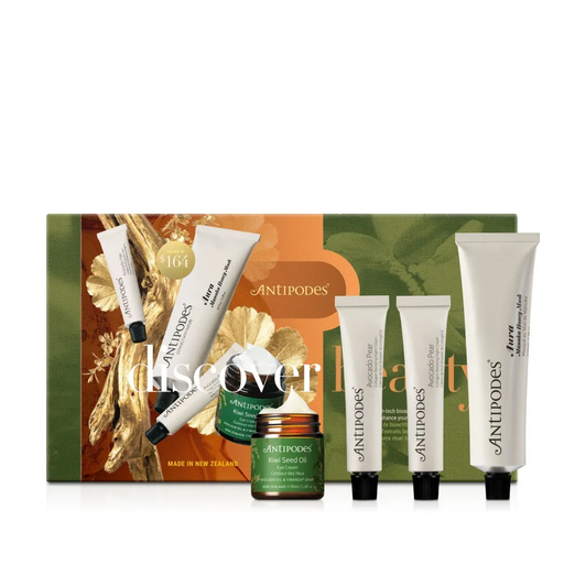 a set of four tubes of anti-aging skincare products from the brand Antipodes, arranged in a row.