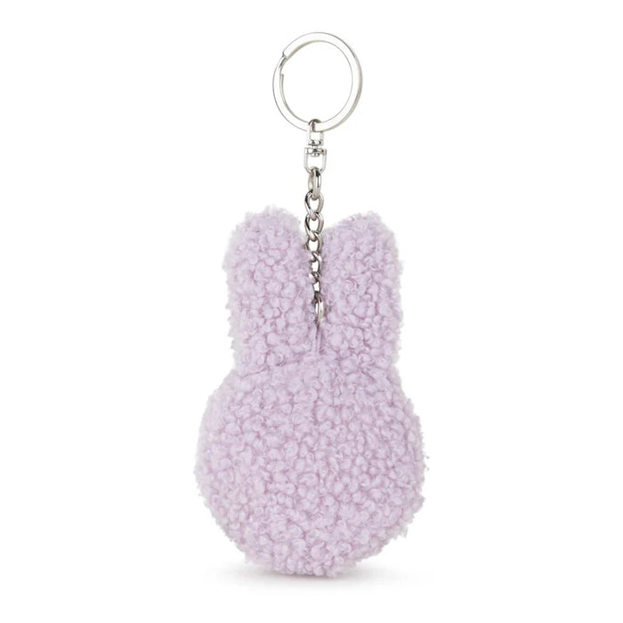 A keychain in the shape of a bunny with a fluffy, textured appearance.