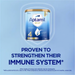 A can of Aptamil Gold+ baby formula is shown against a blue background, with a shield-shaped logo above it.