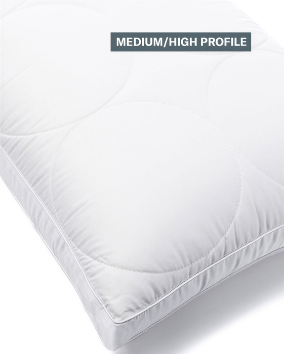 A pillow with a medium/high profile design, featuring a white circular pattern.