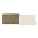 A gold-colored box and a white rectangular bar of soap are shown against a white background.